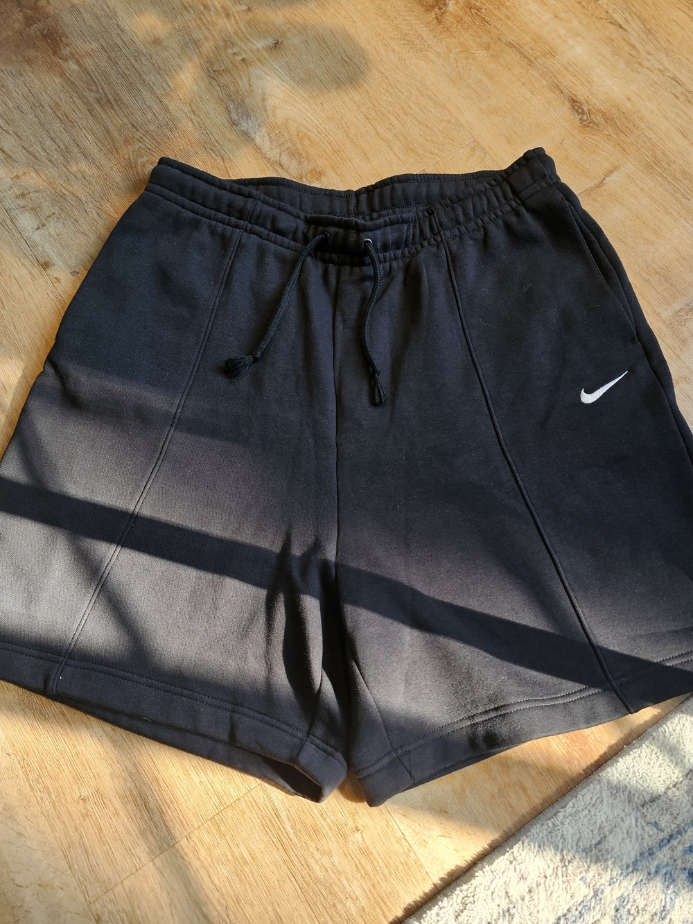 Nike Women's Fleece Pintuck Shorts (Size Large) in Black.